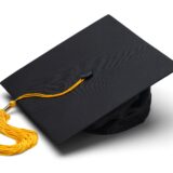 Black Mortar Board Cap with Yellow Tassel Isolated on White Background.