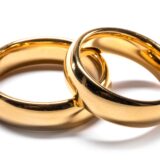 Couple of gold wedding rings isolated on white background